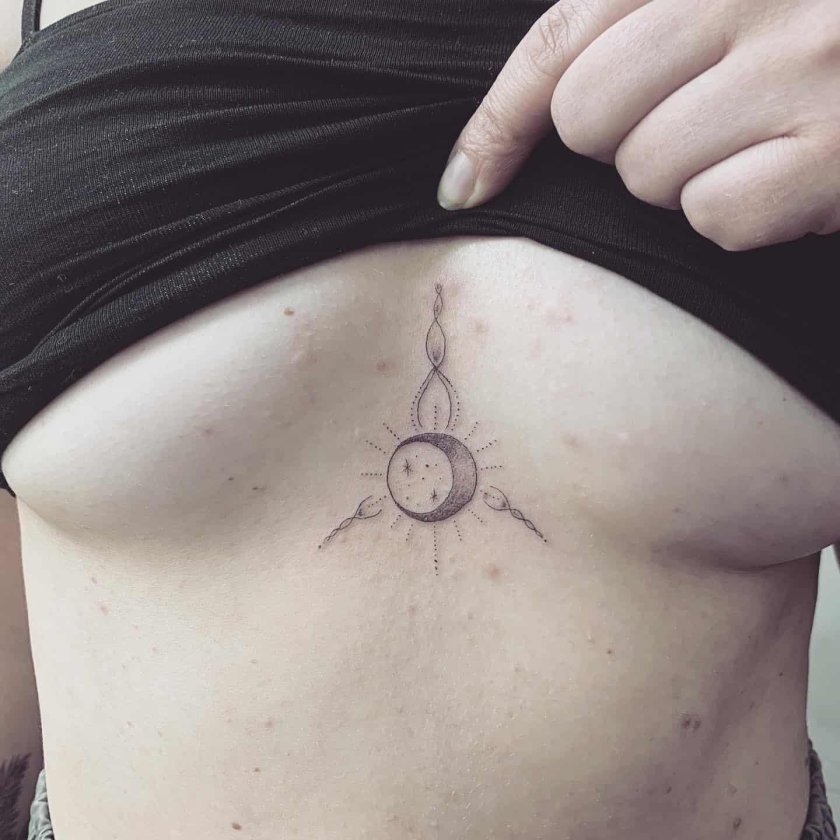 Crescent under the chest tattoo