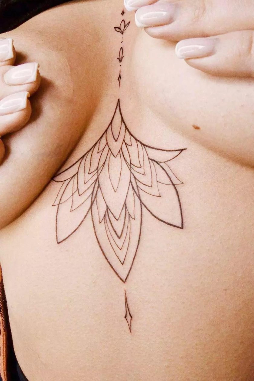 Lotus tattoo under the chest