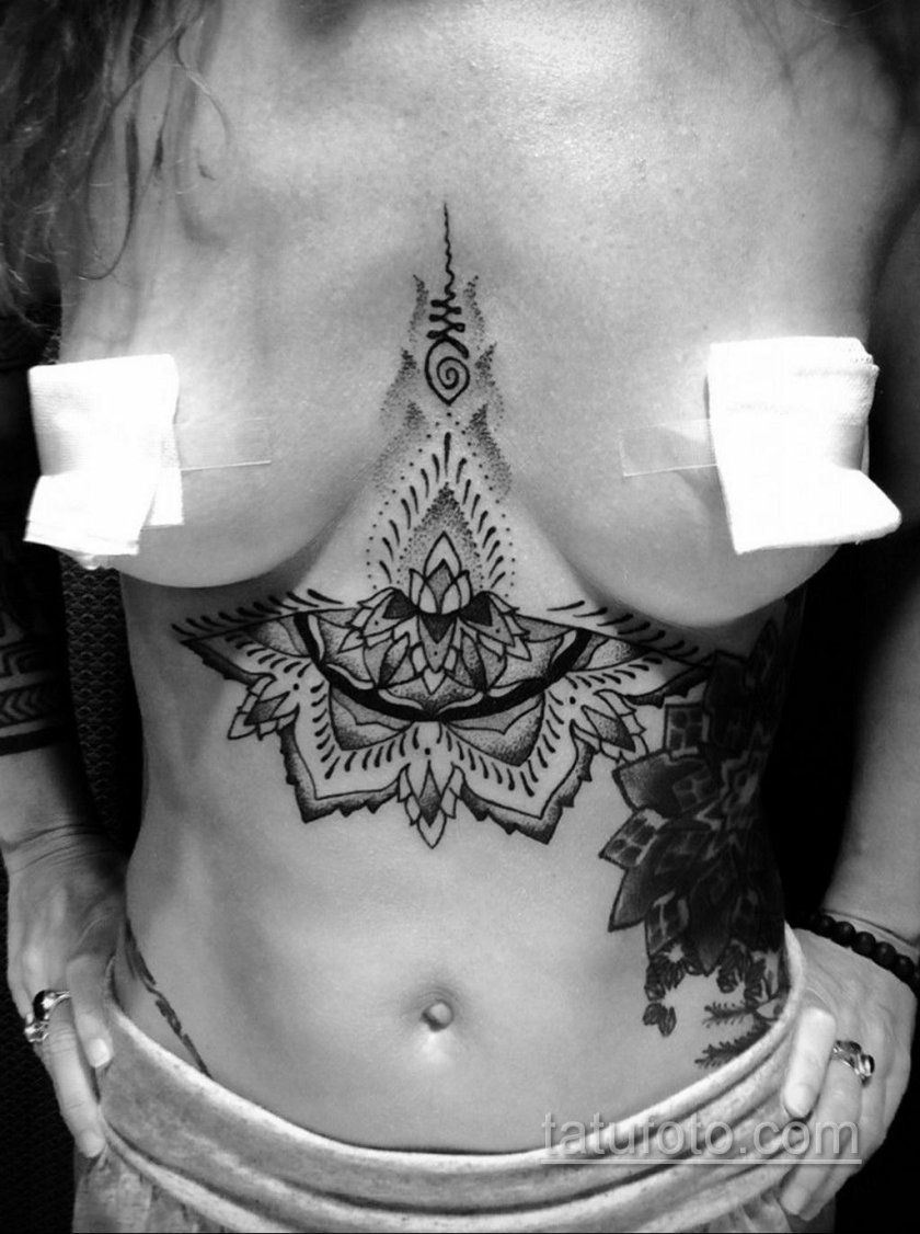 Female tattoos under the chest