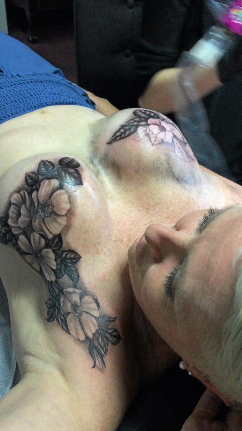 Tattoo on the female breast and nipples