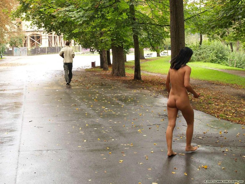 Naked woman runs along the street
